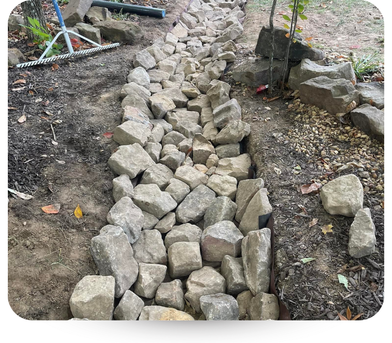 Filling rocks in a ditch. 